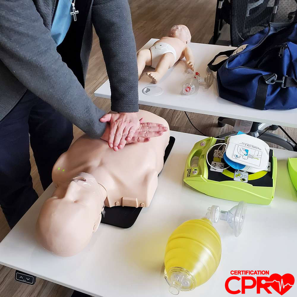 CPR training on mannequin for certification in El Paso.